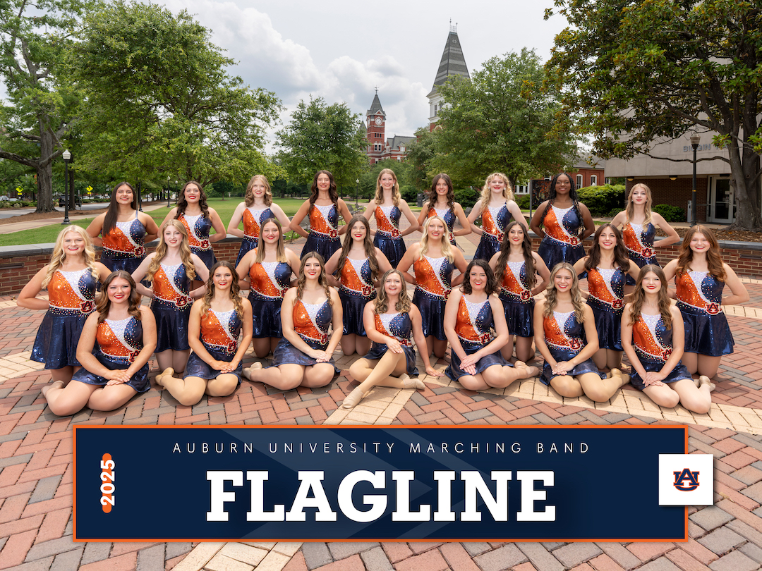 AUMB Flag Line posing near Toomer's corner with Langdon and Samford Halls in the background