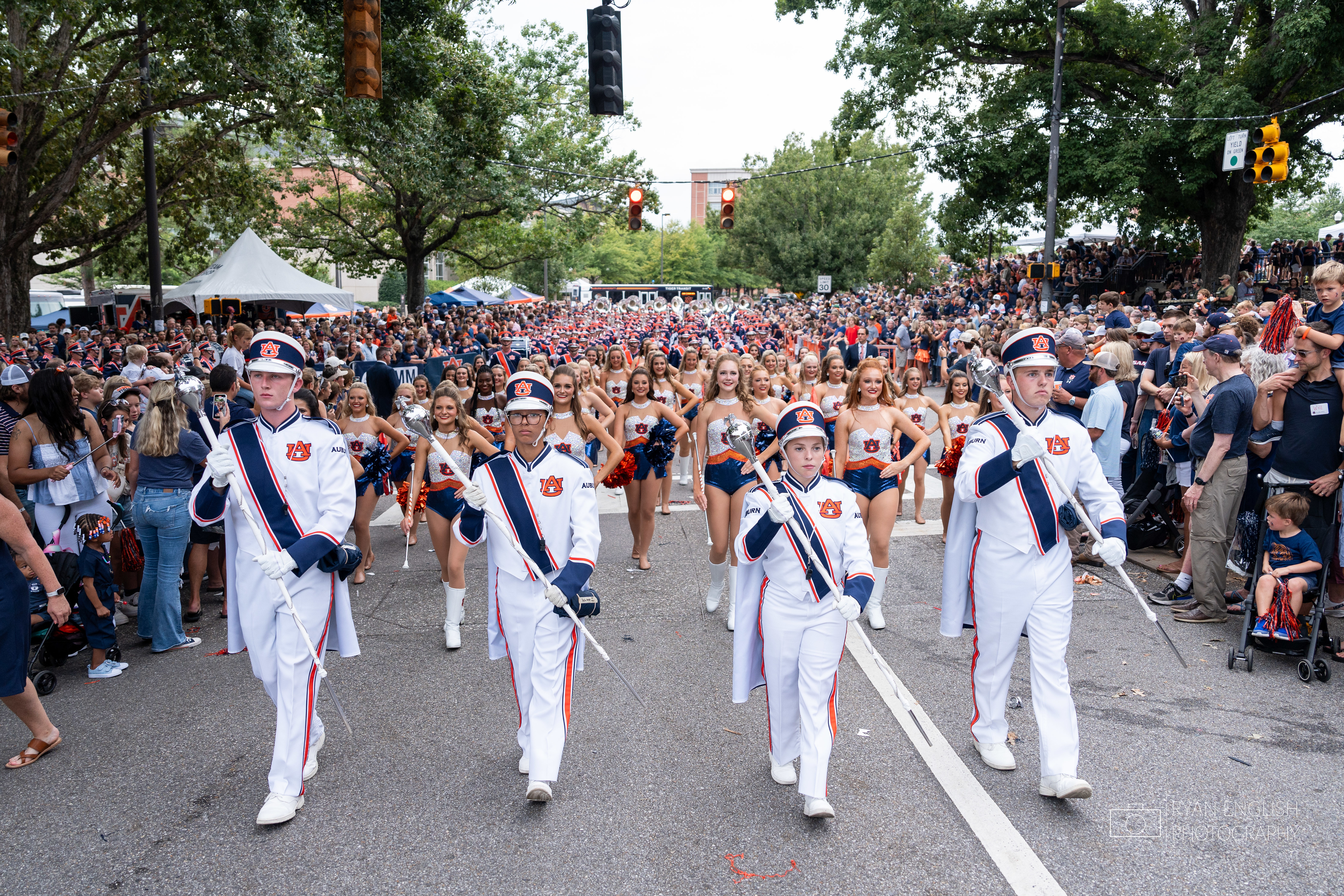AUMB drum majors leading the band in a parade