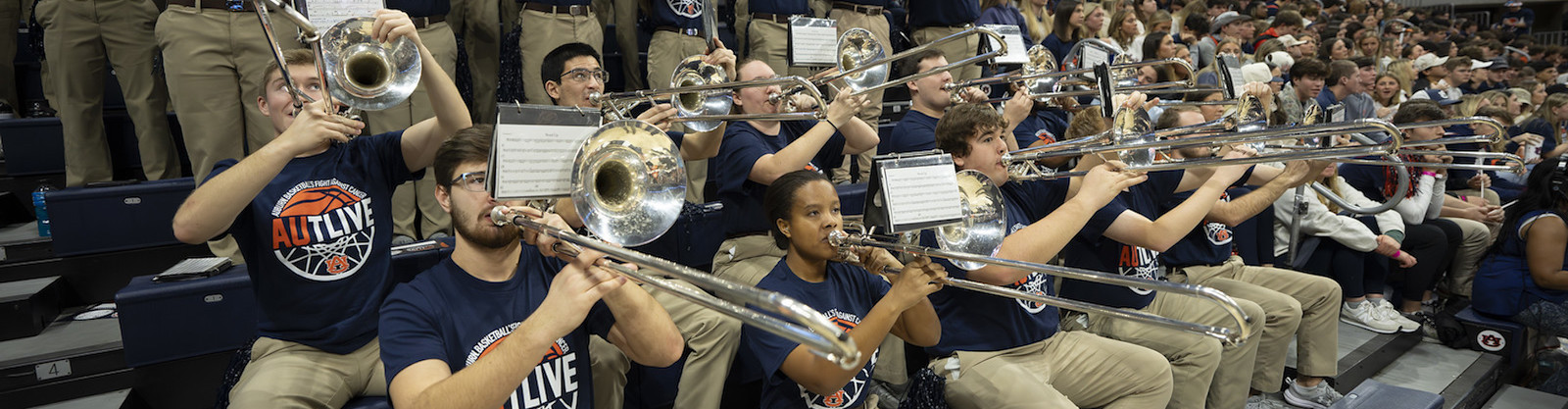 Auburn basketball pep band playing in the stands at a game